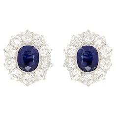 These stunning Edwardian earrings feature a pair of unheated sapphires surrounded by old cut diamonds. The sapphires each weigh 1.00 carat a piece and are an intense blue colour. Enveloping each sapphire, the halo of diamonds total 1.50 carat, with colour ranging from F to G and clarity from VS to SI. Each stone bas been set into platinum, whilst the the posts and butterfly backs are made of 18 carat yellow gold. Gemstone: Sapphire Stone Shape: Oval Cut Carat Weight: 2x 1.00 Age: 1910s Metal: 18ct Yellow Gold, Platinum Edwardian Earrings, Earring Video, Beautiful Diamond Earrings, Sapphire And Diamond Earrings, Diamond Cluster Earrings, Platinum Metal, Antique Earrings, Sapphire Stone, Diamond Cluster Ring