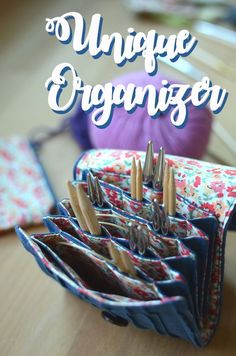 an organizer is sitting on a table with scissors in it and the words unique organizer above it