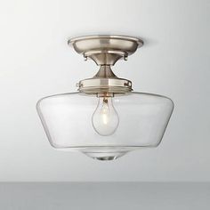 a light fixture with a glass bowl on the ceiling