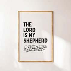 the lord is my shepherd with sheeps in black and white on a light colored wall