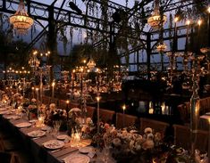 a long table is set up with candles and place settings for an elegant dinner party