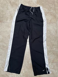 These pants are cool and quality. The are really lightweight and cool. In good shape for their age. They must be bought to be worn.   Brand: Nike Size: Large Material: Polyester Measurements in inches Waist 32-36 Inseam 32 9.9 #37 I do accept returns within 30 days of purchase of all vintage items. The item must be in the same condition in which it shipped and preferably with the tags still on. The customer is responsible for all shipping costs and there is a 20% restocking fee for all returns. Nike Y2k Pants, Nike Pants Vintage, Nike Trackpants Y2k, Vintage Nike Pants Old, Vintage Nike Pants, Nike 90s Vintage Pants, Nike 2000s, Trackpants Nike Vintage, Nike Hose