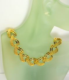 This stunning gold_plated multi chain collar necklace looks like a piece of fine Byzantine jewelry owing to the rich gold-plated metal setting.  The length of this piece of jewelry is almost 16.5" long and 5/8" wide. It weighs 2  oz. The necklace fastens with a flip over clasp.  Condition is excellent with no obvious damage or wear. This is a gorgeous marked Napier  Pat Pend  4.774.743. Vintage piece from 1980's. We combine shipping.   Thank You for visiting our Etsy https://www.etsy.com/shop/Vi Elegant Multi-strand Figaro Chain Jewelry, Gold-plated Chain Choker, Gold Jewelry With Chunky Metal Chain, Gold Chunky Chain Jewelry, Gold Jewelry With Chunky Chain, Gold Plated Chain Choker, Gold-tone Plated Metal Chain Necklace, Formal Metal Choker With Clavicle Chain, Gold Metal Clavicle Chain Necklace