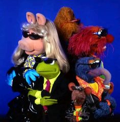 the muppets are dressed up in costumes