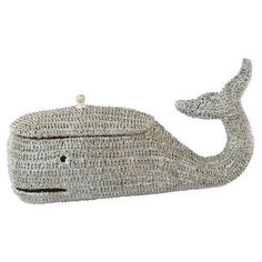 a knitted purse with a whale design on the front and bottom, in grey