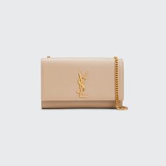 Saint Laurent pebbled leather shoulder bag with gold-tone hardware. Adjustable golden chain shoulder strap, 19" drop. Can be worn on the shoulder or across the body. Flap-top with golden YSL logo medallion; snap closure. Inside, faille lining; open compartment with one slip pocket 6"H x 9"W x 2"D. Approx. weight 1.4 lb. Made in Italy. Ysl Crossbody Bag, Gold Bag, Pebbled Leather, Leather Shoulder Bag, Ysl Bag, Crossbody Bag, Shoulder Strap, Saint Laurent, Tops Designs