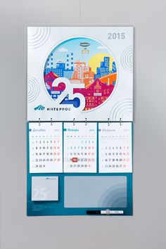 a calendar hanging on the wall with cityscape