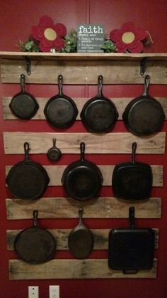 pots and pans are hanging on the wall