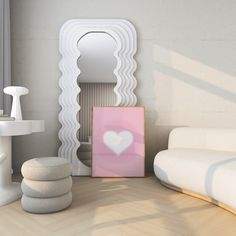 a room with white furniture and a heart shaped mirror