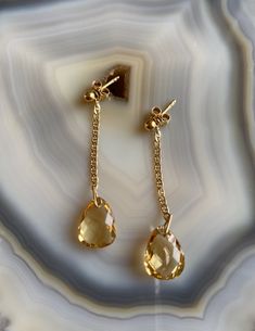 Delicate, feminine and so gorgeous! This is an 18k Gold Filled Earrings featuring a beautiful polished Citrine gemstone. You can see how clear is this stone’s cut. Amazing! Citrine is a great gem to wear to increase motivation! You will love how it will match a lot of your outfits! Product Details: . Size: 2” . Material: 18k Gold Filled Elegant Drop Gemstone, Elegant 14k Gold Earrings With Gemstone Accents, Yellow Gold Teardrop Gemstones For Anniversary, Anniversary Yellow Gold Teardrop Gemstones, Gold Teardrop Gemstones In Sterling Silver, Elegant Citrine Teardrop Earrings, Elegant Teardrop Citrine Earrings, Gold Teardrop Gemstones For Formal Occasions, Gold Teardrop Gemstones For Formal Events