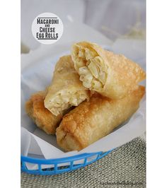 some food is in a blue basket on a table with a white and gray cloth