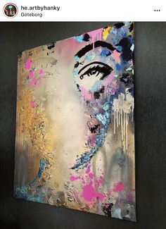 a painting on the wall that has been painted with acrylic and spray paint