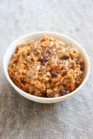 a bowl filled with granola sitting on top of a table