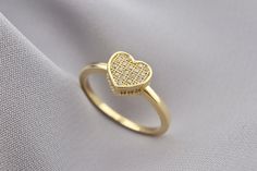 Crafted with elegance and sophistication, this stunning 14k solid gold heart ring is a true symbol of love and romance. The intricate detailing and smooth finish create a timeless piece that effortlessly adds a touch of glamour to any look. The warm hue of the solid gold complements all skin tones, making it a versatile accessory for both everyday wear and special occasions. Whether it's a gift for a loved one or a treat for yourself, this heart ring is a captivating addition to any jewelry coll Dainty Gold Band, Symbol Jewelry, Love Symbol, Gold Heart Ring, Symbolic Jewelry, Ring Minimalist, Ring Dainty, Love Ring, Love Symbols