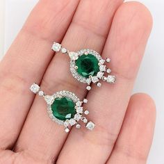 These beautiful earrings feature a pair of 3.57-carat weight round emerald gemstones with natural earth-mined diamonds, all set in solid 14K gold. These earrings can be a lovely May birthstone gift for your loved ones! These earrings are made with solid 14k Gold and natural earth-mined SI / G-H Diamonds. As listed, these earrings are ready to ship. If you're interested in purchasing this setting with a different center stone please message us! Emerald Drop Earrings, Emerald Earrings Drop, Designer Silver Jewellery, Jewelry Showcases, Zambian Emerald, May Birthstone, Birthstone Gifts, Emerald Gemstone, Earring Findings