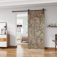 a living room with wooden floors and an ornate door that has been painted on it