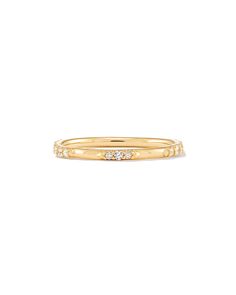 The Posey 14k Yellow Gold Band Ring in White Diamonds is a forever piece, whether intended to be a wedding band, anniversary gift, or ultimate wishlist spend. Crafted with a dusting of hand placed White Diamonds around a 14k Gold band, this heirloom ring is thoughtfully designed to last a lifetime. 

 We have taken steps to ensure that, when applicable, our diamonds are conflict free by requiring our suppliers to comply with the Kimberley Process. 14k Gold Bands With Diamond Accents, Luxury Halo Stackable Rings With Round Band, Fine Jewelry 14k Gold Half Eternity Stackable Rings, Anniversary Halo Stackable Rings In Fine Jewelry Style, Luxury Halo Stackable Rings, Timeless 14k Gold Eternity Promise Ring, 14k Gold Half Eternity Stackable Rings, Yellow Gold Stackable Diamond Rings With Halo, Timeless 14k Gold Eternity Band With Diamond Cut