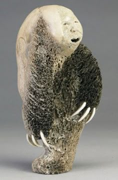 a sculpture of a bear with its mouth open