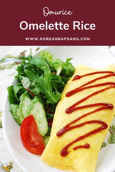 omelette rice with ketchup and vegetables on a white plate next to a salad