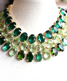 Green Gold Necklace Anna Wintour Peridot Emerald Chrysolite Georgian Collet Riviere Paste Vintage choker Statement Stacked Oval Layer Chunky Discover the enchanting world of our Anna Wintour-inspired layer necklaces, a mesmerizing collection that artfully blends Emerald Green, Peridot Green vibrant multi-green palette. Each necklace in this exquisite range is a tribute to the timeless elegance and bold fashion statements synonymous with Wintour's iconic style. In green, you'll find the serenity of the ocean depths, a color that speaks of mystery and sophistication. The emerald green offers a deeper, more introspective hue, reminiscent of the green grass and perfect for adding a touch of classic refinement to any ensemble. The bottle green is like a breath of fresh air, light and ethereal, Green Gold Necklace, Layer Necklaces, Green Palette, Vintage Choker, Peridot Green, Fashion Statements, Anna Wintour, Iconic Style, Green Peridot