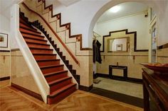 a staircase in a house with tiled walls