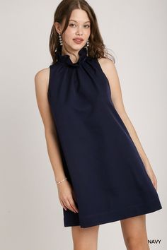 Sleeveless Dress with Ruffle Neck, Pleats & Back Bow Tie Measurements: Bust: small 36", medium 38", large 40" Length: small 34", medium 34.5", large 35" 2025 Inspiration, Unique Bow Tie, Ruffle Neck Dress, Bow Back, The Grove, Hair Accessories Jewelry, Navy Dress, Tie Back, Hat Hairstyles