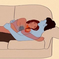 a woman laying on top of a couch next to a man