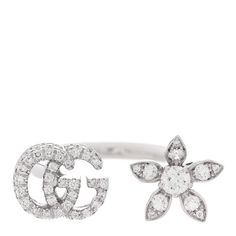 This is an authentic GUCCI 18K White Gold Diamond Flora GG Open Ring size 51 5.75. The ring is crafted of 18 karat white gold and features an open ring with the double G logo motif and a floral motif pave-set with round brilliant cut diamonds, approximately .55 total carat weight. Gucci White Gold Ring In Fine Jewelry Style, Gucci Fine Jewelry White Gold Rings, Gucci White Gold Fine Jewelry Ring, Gucci White Gold Ring For Formal Occasions, Gucci White Gold Luxury Ring, Gucci White Gold Ring Formal, Gucci White Gold Jewelry For Anniversary, Luxury Hallmarked Gucci Rings, Gucci Luxury White Gold Rings