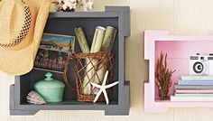 a shelf that has some books, pictures and other items on it with a camera