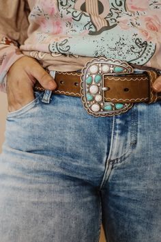 Angel Ranch Ladies belt by M&F Western Products. Genuine leather body accented with antique silver rectangle conchos that have turquoise and white stones. The outer edge of the conchos and stones are trimmed in antique copper for a beautiful accent. Available in sizes S-XL. Details Angel Ranch Ladies Belt Brown Sizes: S, M, L, XL Width: 1-1/2 Genuine Leather Scalloped Conchos with Turquoise and White Stones Matching Buckle Design Turquoise Shoes Outfit, Big Belt Buckle, Western Belts For Women, Buckle Display, Buckles Belt, Country Belts, Turquoise Shoes, Western Car, Ladies Belt