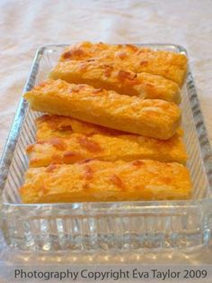 three pieces of bread sitting in a glass dish