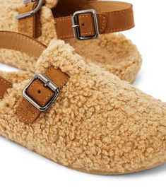 Faux shearling slippers in beige - Il Gufo | Mytheresa Comfortable Slip-on Slippers With Buckle Closure, Shearling Slippers With Textured Footbed And Round Toe, Shearling Slip-on Slippers With Textured Footbed, Brown Slip-on Slippers With Buckle Closure, Brown Closed Toe Slippers With Buckle Closure, Shearling Slippers, Slippers