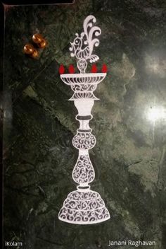 an intricately designed candle holder is on display