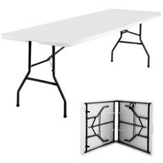 a white folding table with black legs and an open fold - up book on top