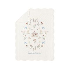 a white handkerchief with animals and flowers on it