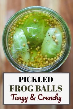 pickled frog balls in a jar with text overlay that reads pickled frog balls, tangy and crunchy