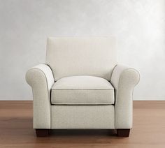 a white chair sitting on top of a hard wood floor