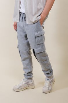 Discover the ideal fusion of work-ready functionality and urban style with our Fleece Utility Cargo Sweatpants. Designed to seamlessly transition between work and leisure, these sweatpants boast a relaxed yet refined fit that exudes effortless sophistication. Elevate your ensemble with the utility-inspired cargo pocket details, providing ample space for your essentials while adding a dash of rugged charm. The elastic waist and ankles ensure a snug yet flexible fit, allowing you to conquer any ta Functional Cotton Sweatpants With Side Pockets, Functional Cotton Joggers With Pockets, Functional Cotton Joggers With Side Pockets, Functional Cotton Sweatpants With Pockets, Functional Winter Pants With Side Pockets, Functional Pants With Side Pockets For Winter, Full-length Sweatpants With Pockets For Jogging, Urban Joggers With Side Pockets, Full Length Sweatpants With Pockets For Jogging