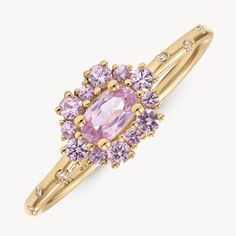 14k Yellow Gold Ring with Natural Sapphires and Diamonds. A delightful cluster of pink Sapphires, inspired by the seasonal beauty of Sakura or cherry blossom, all set on our signature band of Diamond stars. A bloom representing mortality, mindfulness and living in the present, Japanese cherry blossoms are a timeless metaphor for human existence. Blooming season is powerful, glorious and intoxicating, but tragically short-lived‚ this stunning piece reminder to enjoy the beauty within every given Audry Rose, Tiara Ring, Pink Spinel, Diamond Star, Eternity Band Diamond, Natural Sapphire, Gems Jewelry, Sapphire Diamond