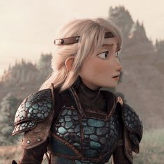 an animated image of a woman with blonde hair wearing armor and standing in front of a mountain