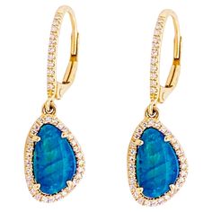 Blue, blue opals look like the ocean with hint of green! These earrings are going to POP when you wear them. Bright blue opals will shine bright with long or short hair! These opal favorites have diamonds surrounding the organic shape and diamonds on the lever back earrings. I love this style as they have a nice swing to them as you move your head and they fall just below your earlobe. Also, no earring backs to keep up with! Material: 14K yellow gold Opal Weight: 0.98 carats Diamond Weight: 0.18 Opal Earrings Dangle, Diamond Halo Earrings, Opal Earring, Halo Diamond Earrings, Halo Earrings, Diamond Dangle Earrings, Link Earrings, Star Jewelry, Earring Crafts