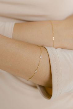 Both elegant and timeless, this bracelet features six bezeled diamonds on a delicate cable chain. Length: 7" Material & Care 14k Yellow Gold Hypoallergenic Can be worn in water For more info: Jewelry Care How to Wear Wear alone or stacked with your favorite bracelets. Bracelet Designs Gold For Women, Bracelets Gold Simple For Women, Minimal Gold Bracelet, Simple Gold Bracelet, Maharashtrian Jewellery, Diamond By The Yard, Delicate Gold Bracelet, Gold Bracelet Simple, Simple Jewellery