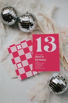 a pink and white birthday party with disco balls