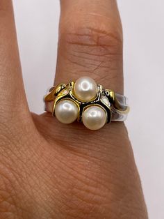 Vintage white cultured pearl  Sterling silver with gold setting   Re sizing has a $20 jeweler's fee. All rings are shipped in a nice gift box.   Check out our over a THOUSAND great reviews Engraving is $4 per letter and is not always perfect depending on the piece. It can take a few days if the jeweler is busy. This is payable to Paypal Judithsltd@gmail.com White Hallmarked Pearl Ring For Anniversary, White Hallmarked Pearl Anniversary Ring, 14k Stamped Pearl Ring As Gift, White Gold Pearl Ring Stamped 14k For Gift, Classic White Pearl Ring For Gifts, Luxury 14k Stamped Pearl Ring As Gift, 14k White Gold Pearl Ring Gift, White Pearl Ring Stamped 14k As Gift, White 14k Stamped Pearl Ring For Gift