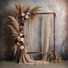 an old photo frame with flowers and feathers on the front is displayed in this artistic photograph