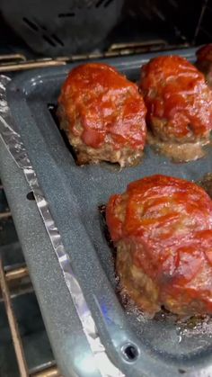 some meatballs are being cooked in the oven