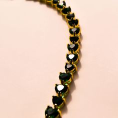 The Heart Emerald Necklace is a stunner! The vibrant heart shaped emeralds are unique and timeless. The rich green tone of the emeralds are complemented by the graduated heart shaped stones. Wear this stunning necklace solo or with others for an elevated look. 16-18 inches Green Necklaces For Valentine's Day Party, Green Heart-shaped Formal Jewelry, Green Heart-shaped Jewelry For Party, Green Emerald Heart Necklace, Green Heart-shaped Jewelry For Formal Occasions, Green Heart-shaped Party Jewelry, Green Emerald Heart Cut Jewelry, Elegant Green Emerald Heart Pendant Necklace, Heart Cut Emerald Green Jewelry