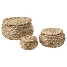 three round woven baskets with lids on each one and two smaller ones in the middle