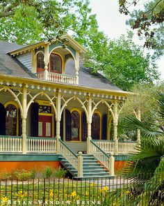 an old style house with porches and columns