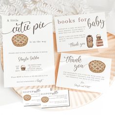 the little cute pie baby shower is set on top of a paper plate with matching cards and envelopes